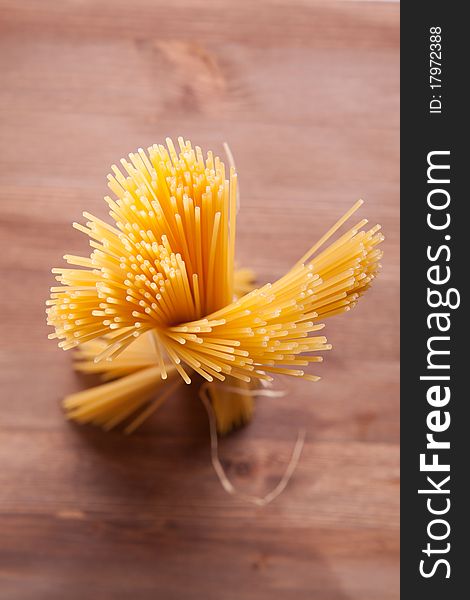 Bunch of spaghetti on a wooden table