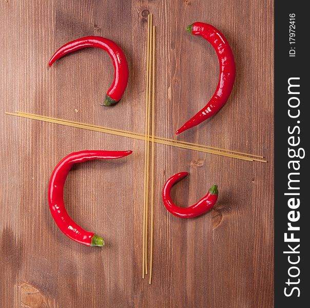 Four section from spaghetti with red hot chilli peppers