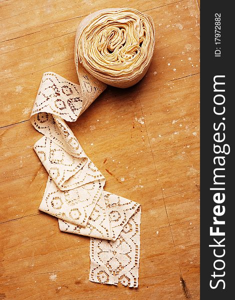 Lace On Wooden Background