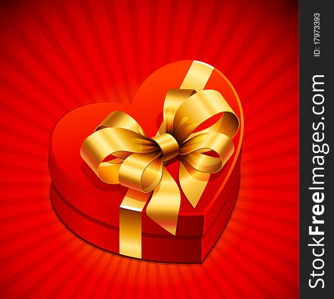 Red heart shape gift with golden bow