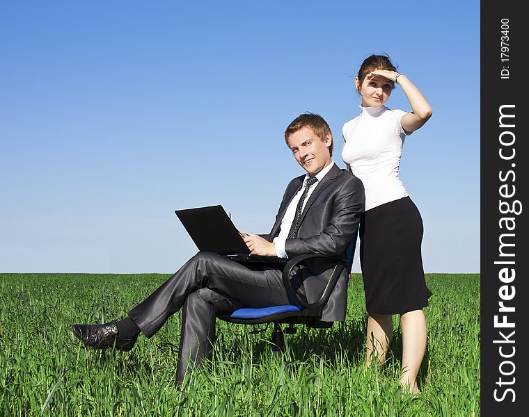 Happy Young Businessman On Spring Field