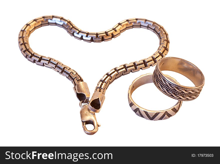 The silver bracelet and rings as simbol of Valentine's day. The silver bracelet and rings as simbol of Valentine's day