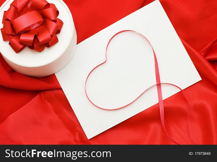 Box With A Gift On A Red Fabric