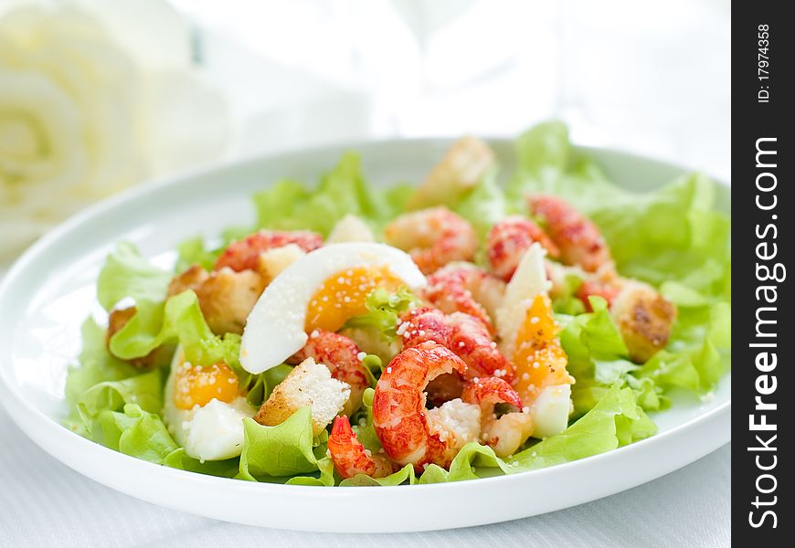 Fresh salad with shrimp and egg for appetizer