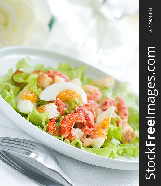 Fresh salad with egg and shrimp for appetizer