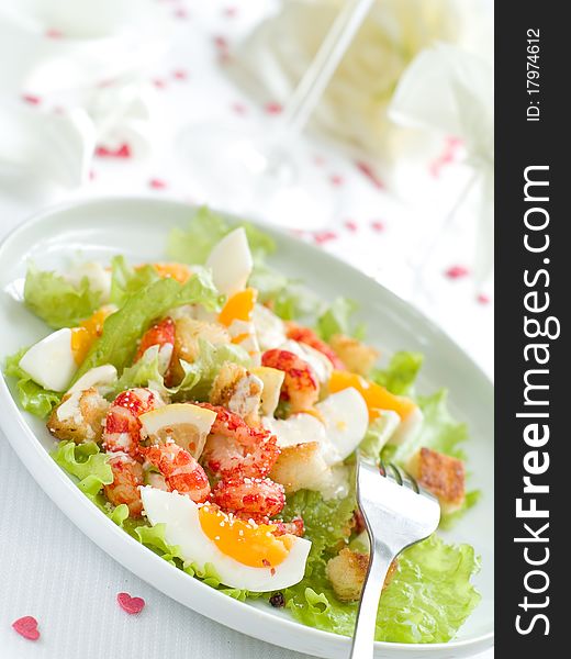 Fresh salad with shrimp and egg for appetizer