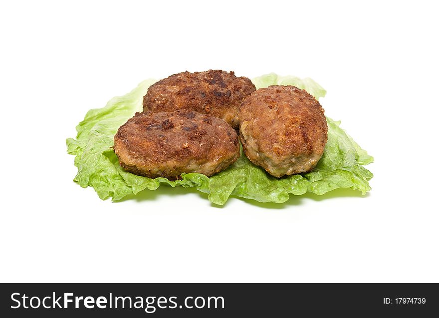 Frikadeller with a salad on a white background