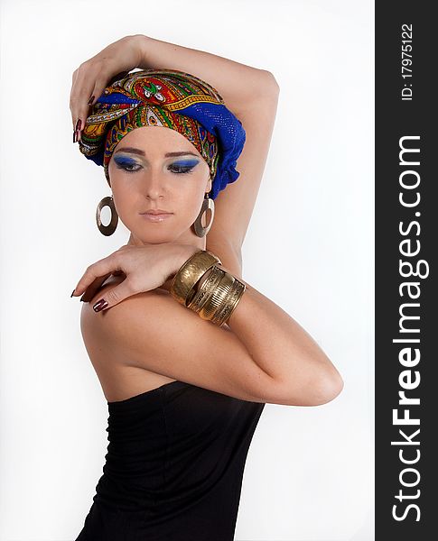 Portrait of young attractive woman in turban with bright make-up over white. Portrait of young attractive woman in turban with bright make-up over white