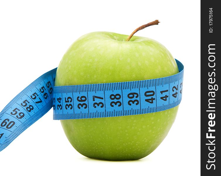 Green apple with centimeter isolated over white background