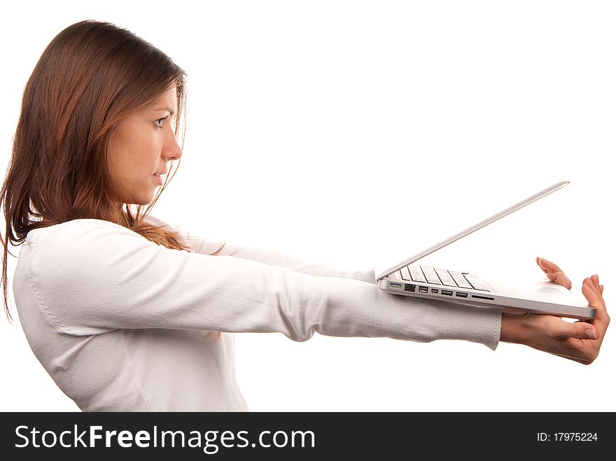 Young woman giving laptop computer, holding laptop in hands isolated on a white background