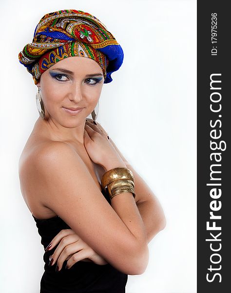 Portrait of young attractive woman in turban with bright make-up over white. Portrait of young attractive woman in turban with bright make-up over white