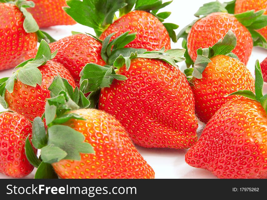 Fresh natural organic strawberries isolated on a white background