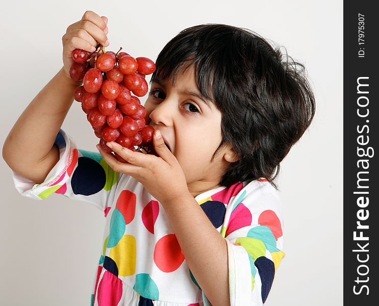 Sweet and cute toddler eating graphs