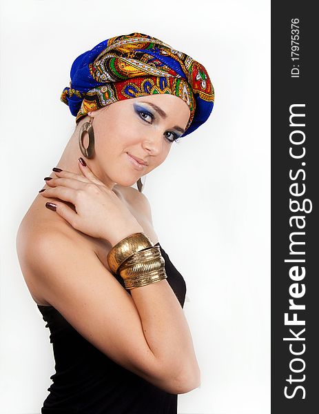 Portrait of young attractive woman in turban with bright make-up over white. Portrait of young attractive woman in turban with bright make-up over white