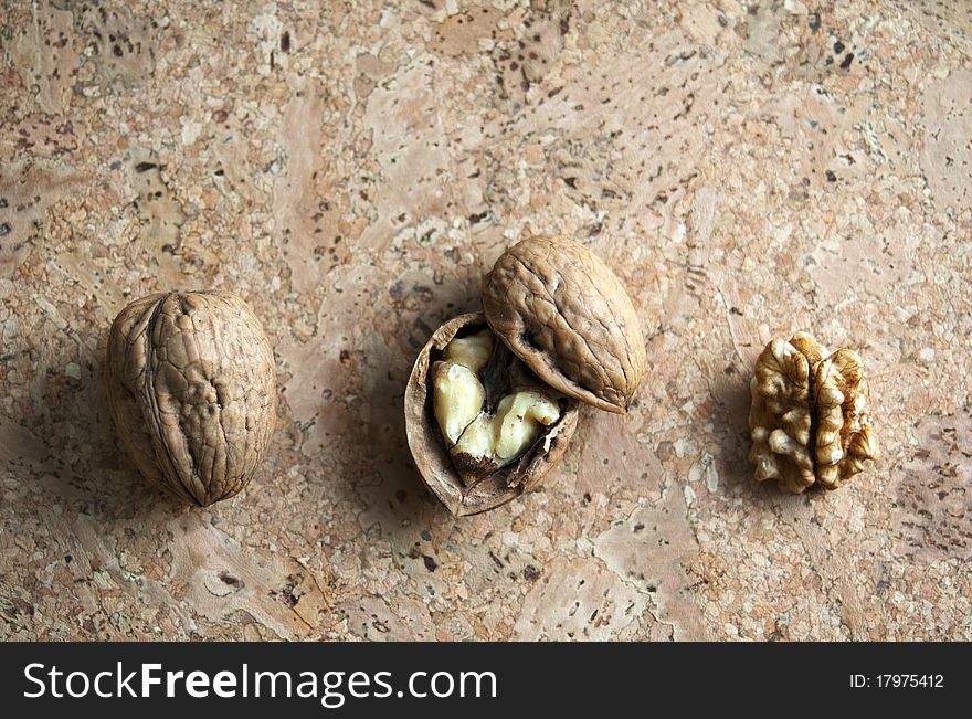 Walnuts isolated on cork background