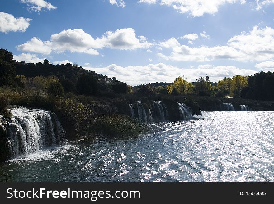 A series of waterfalls on a large river in Spain. A series of waterfalls on a large river in Spain.