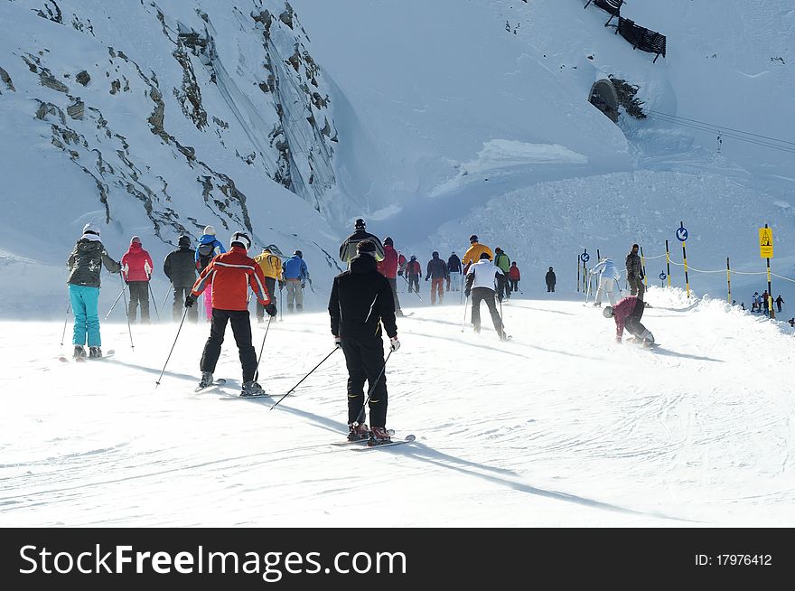 Skiers on crowded slope of Austrian glacier in Solden can't wait to start downhill. Skiers on crowded slope of Austrian glacier in Solden can't wait to start downhill.