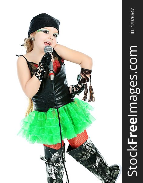 Shot of a little girl singing rock music with a microphone. Isolated over white background. Shot of a little girl singing rock music with a microphone. Isolated over white background.