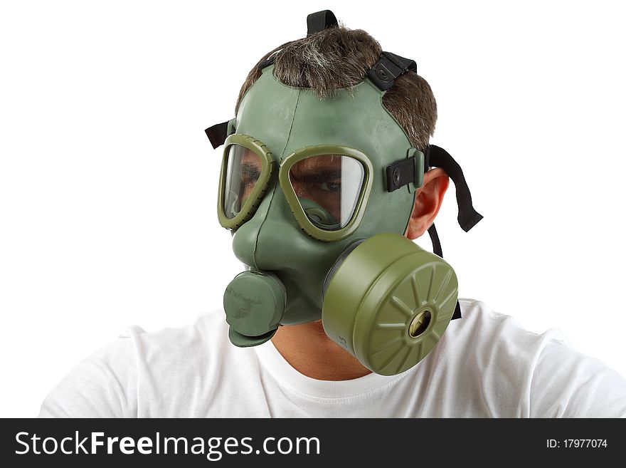 Man in gas mask sitting and looking angry. Man in gas mask sitting and looking angry