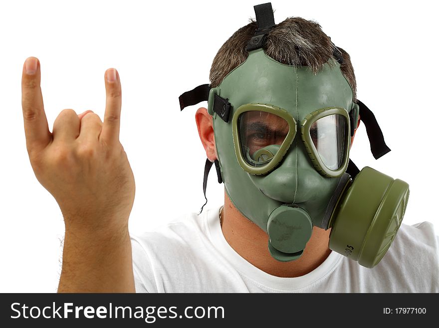 Man in gas mask sitting and showing sign with his hand. Man in gas mask sitting and showing sign with his hand