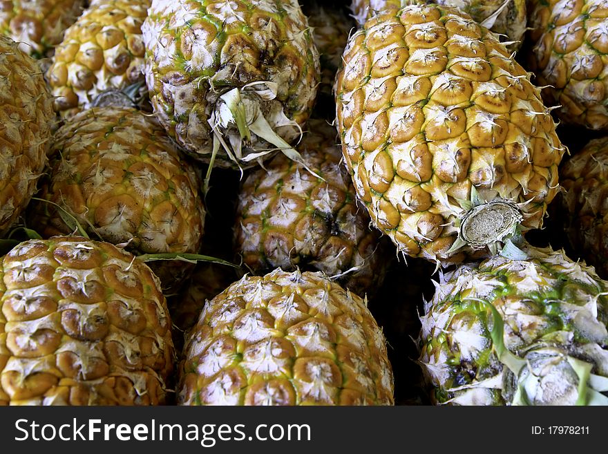 A basket of pineapples at a market