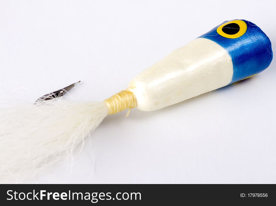 Blue Popper salt water fly isolated on a white background. Blue Popper salt water fly isolated on a white background