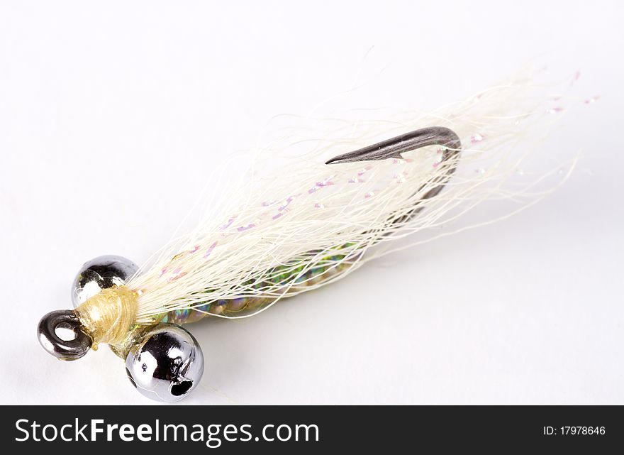 White bead head salt water fly isolated on a white background. White bead head salt water fly isolated on a white background