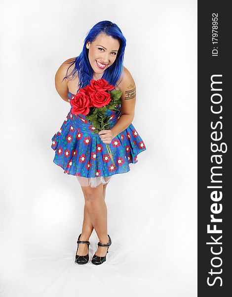 Portrait of a beautiful woman holding a bouquet of roses