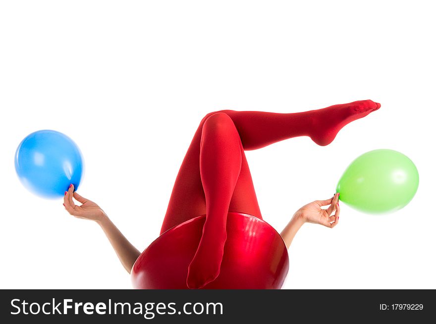 Female feet in red stockings with balloons isolated in white