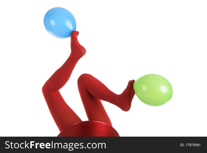 Female feet in red stockings with balloons isolated in white