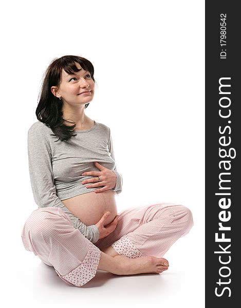 Pregnant young woman in studio. Pregnant young woman in studio