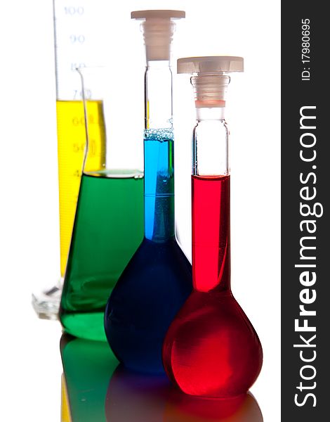 Labolatory glassware with colorful fluids isolated