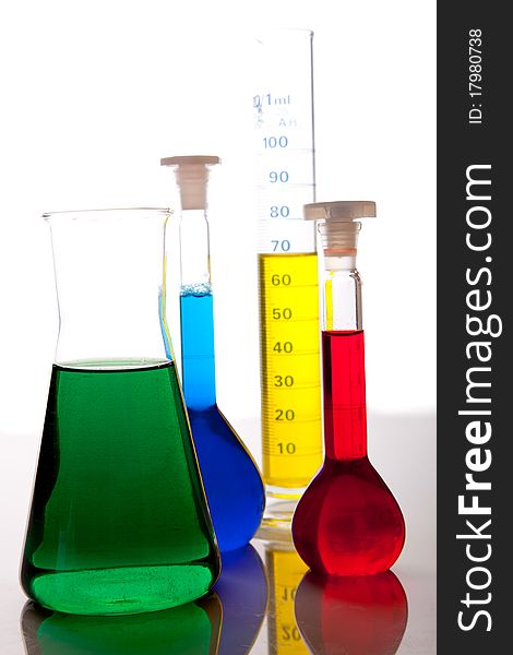 Labolatory glassware with colorful fluids isolated