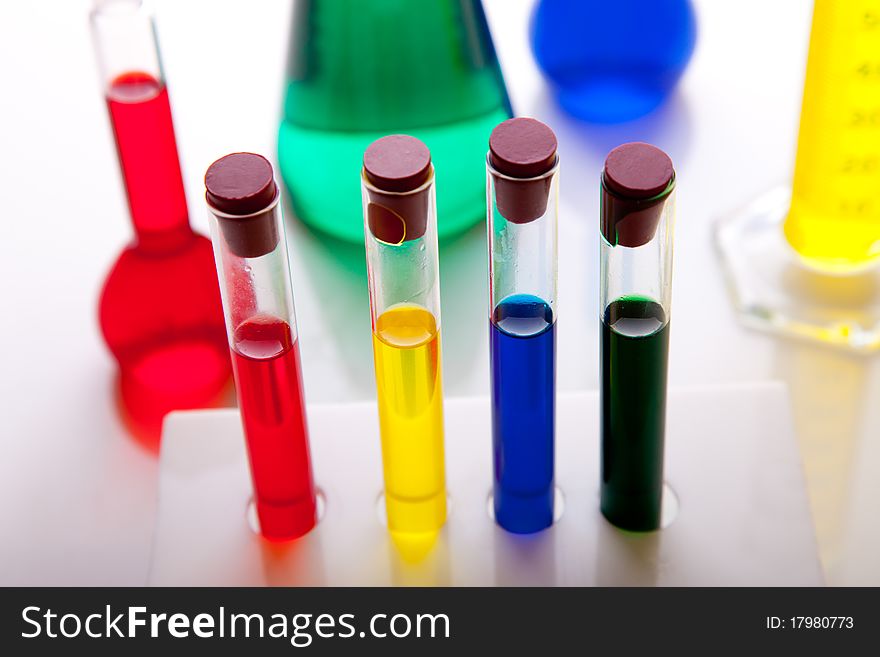 Labolatory glassware with colorful fluids isolated