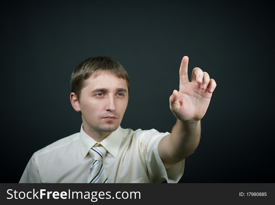 Man trying touch something. studio portrait