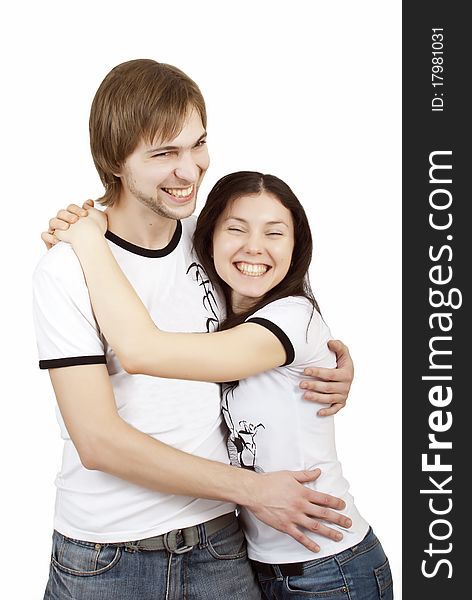 Beautiful young couple laughing and hugging. Beautiful young couple laughing and hugging