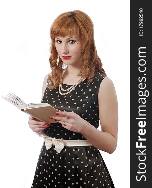 Retro girl in polka dot dress with the book in the hands. Retro girl in polka dot dress with the book in the hands