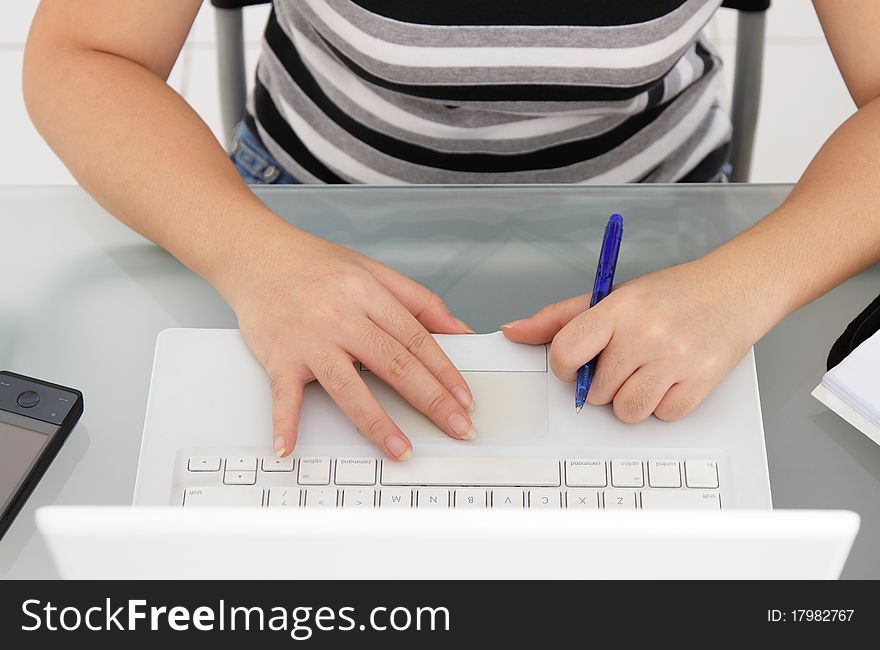 Close-up of a woman's arms on a laptop. Close-up of a woman's arms on a laptop