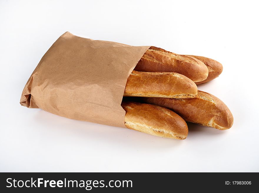 Loaf of white bread, packaged in a paper bag on white background. Loaf of white bread, packaged in a paper bag on white background