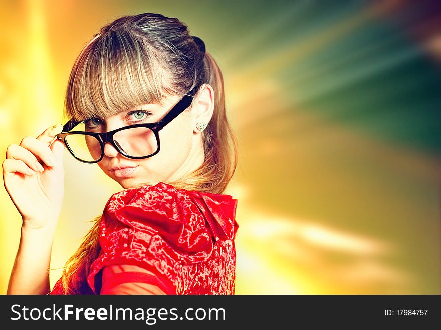 Cute young girl in red dress at abstract light background. Cute young girl in red dress at abstract light background