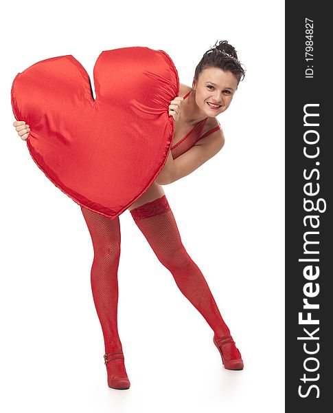 Young woman in red lingerie holding big Heart over white. Young woman in red lingerie holding big Heart over white