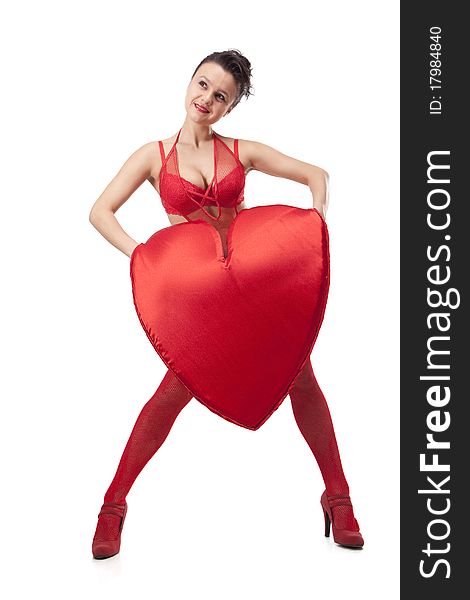 Young woman in red lingerie holding big Heart over white. Young woman in red lingerie holding big Heart over white