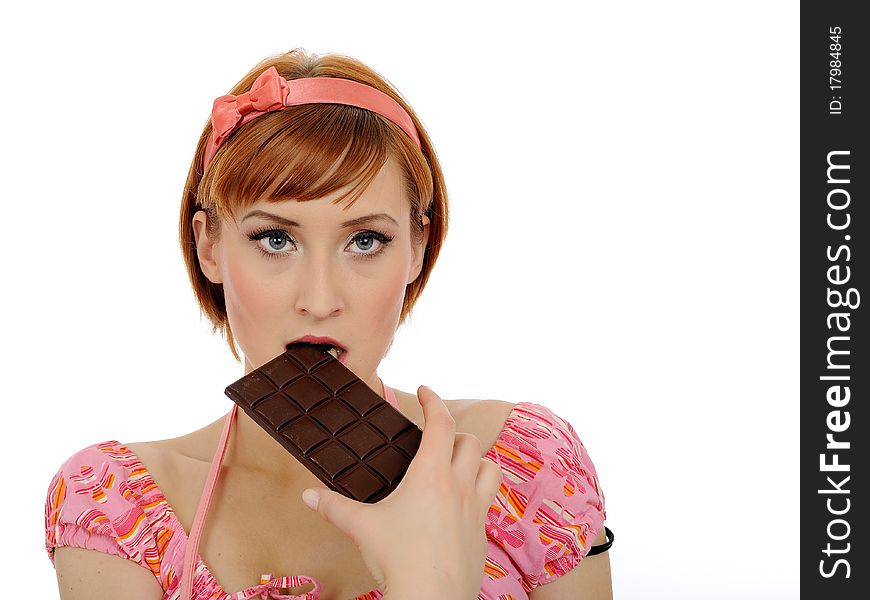 Beautiful woman eating chocolate bar.isolated