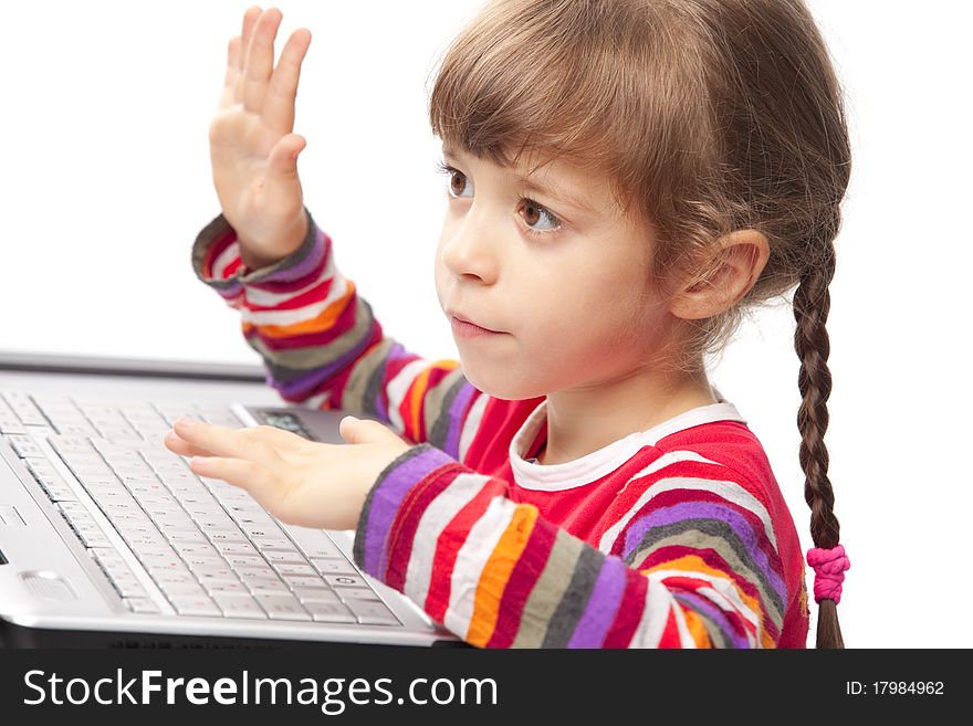 Portrait of a little girl with a laptop