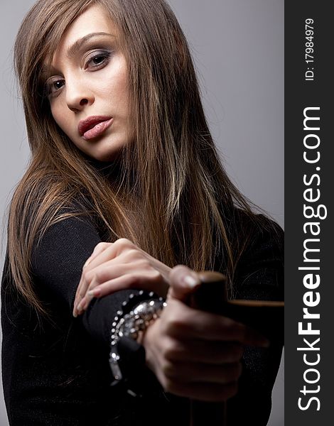 Young  lady with accessories portrait in dark tones