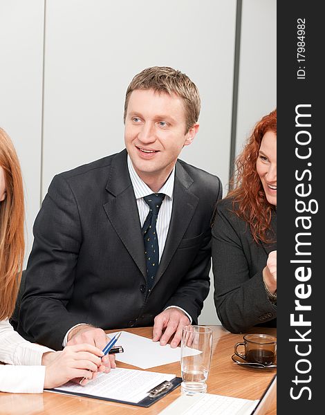 Manager on meeting with workers in his office