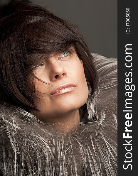 Attractive woman in fur coat