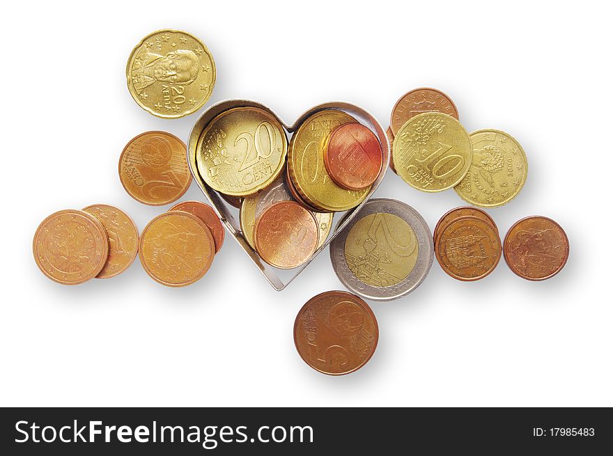 Coins isolated on the white background with clipping paths and metal heart. Coins isolated on the white background with clipping paths and metal heart.