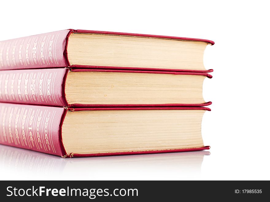 Old red books on white background. Isolated.