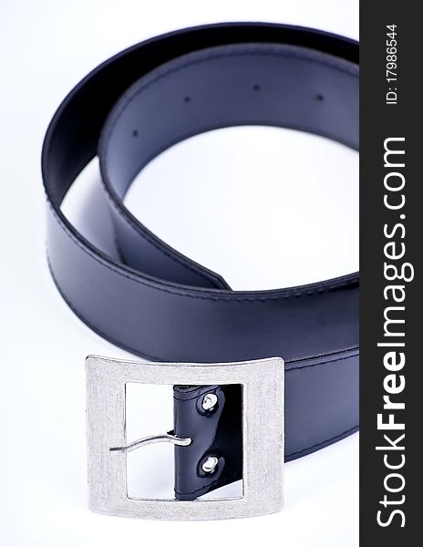 Belt strap and buckle wrapped up on a white background